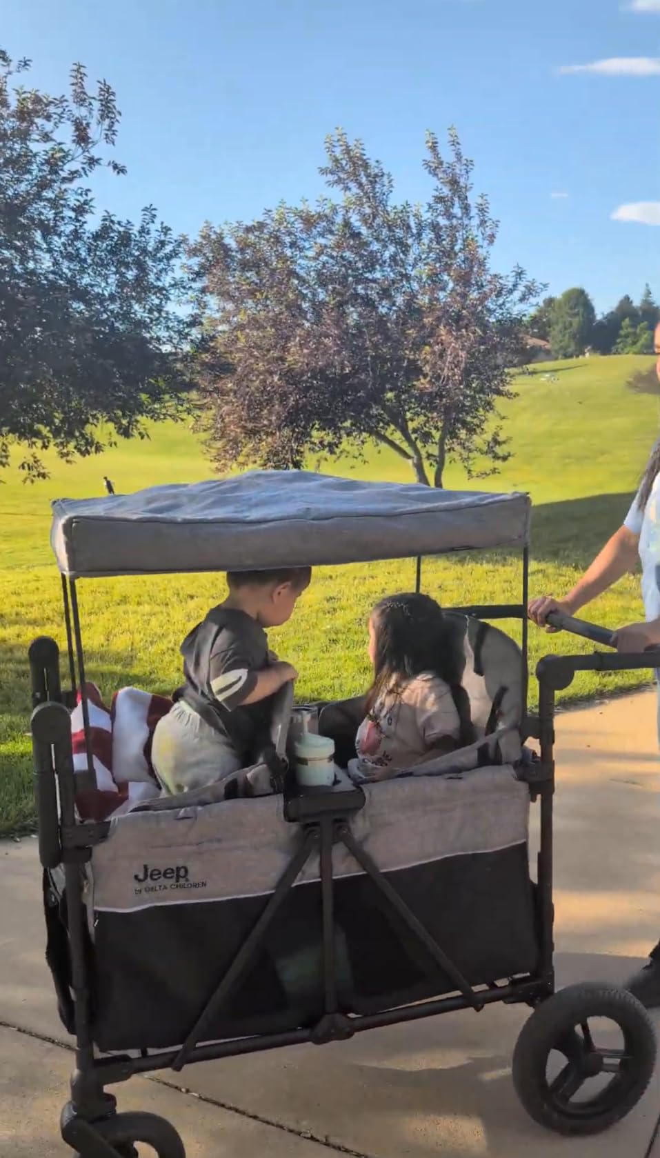 Jeep Wrangler Deluxe 4 Seater Stroller Wagon by Delta Children - Premium Quad Stroller Wagon for 4 Kids with Convertible Seats, Adjustable Push/Pull Handles, Removable Canopy & Flat Fold, Grey customer photo 1